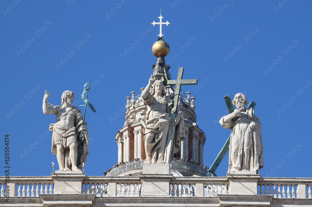 Statues on the top of Saint Peter Basilica facade. Rome, Italy