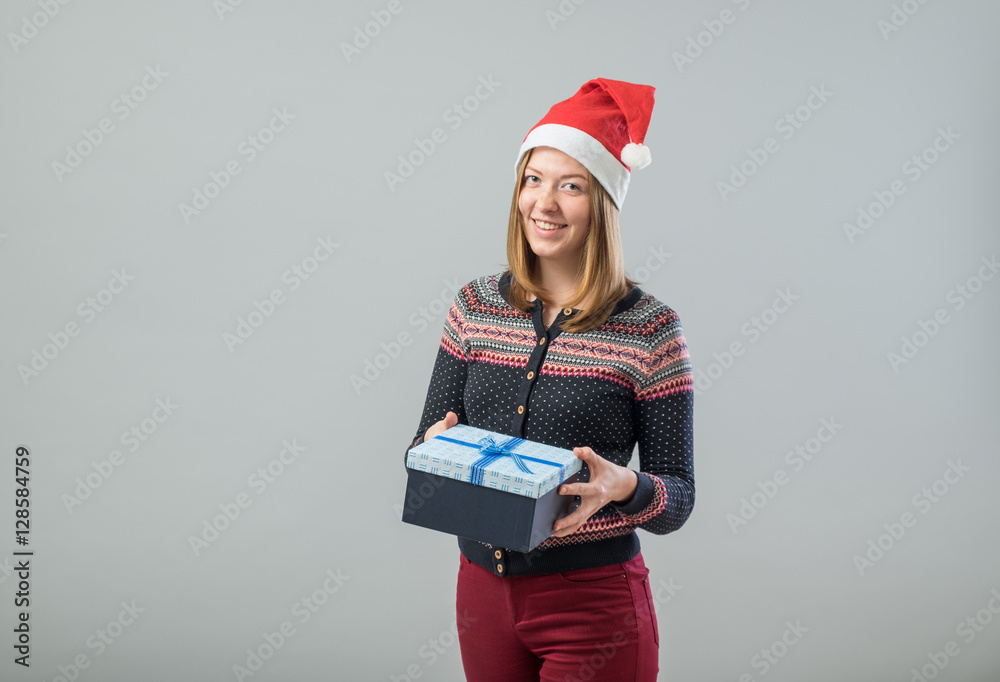 Young woman hold christmas gift Young woman hold christmas gift