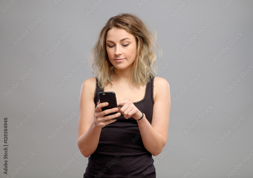 Casual woman using her smartphone Casual woman using her smartphone