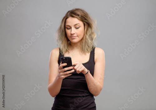 Casual woman using her smartphone