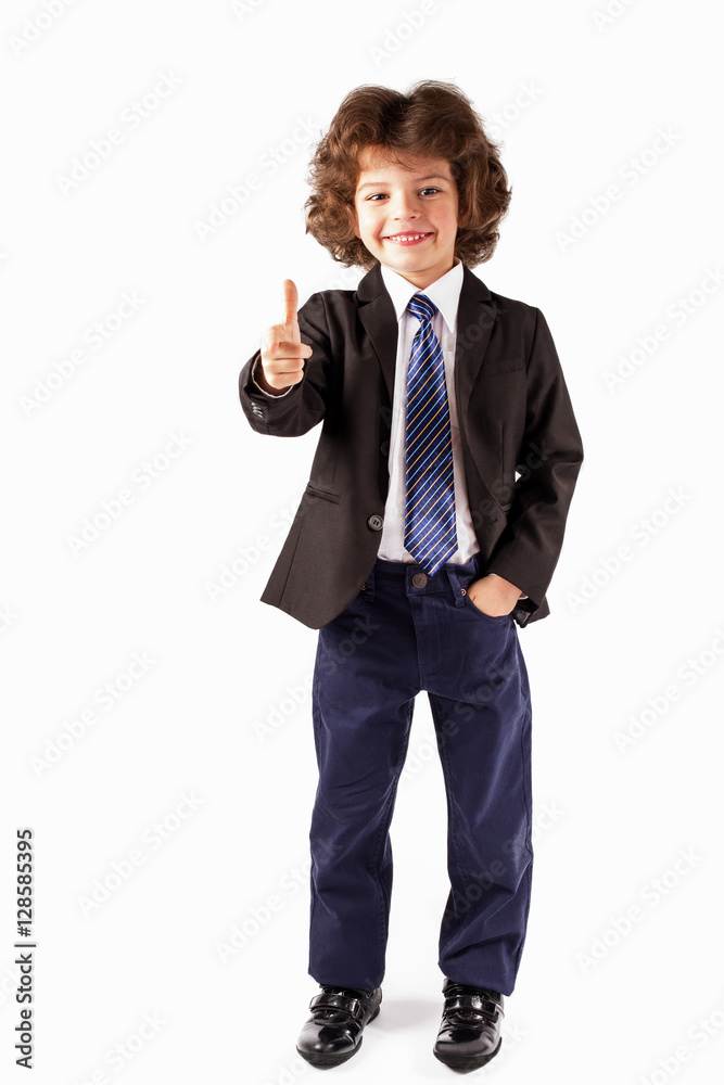 Cute little boy casually holds out his hand in greeting. White background. Cute little boy casually holds out his hand in greeting. White background.