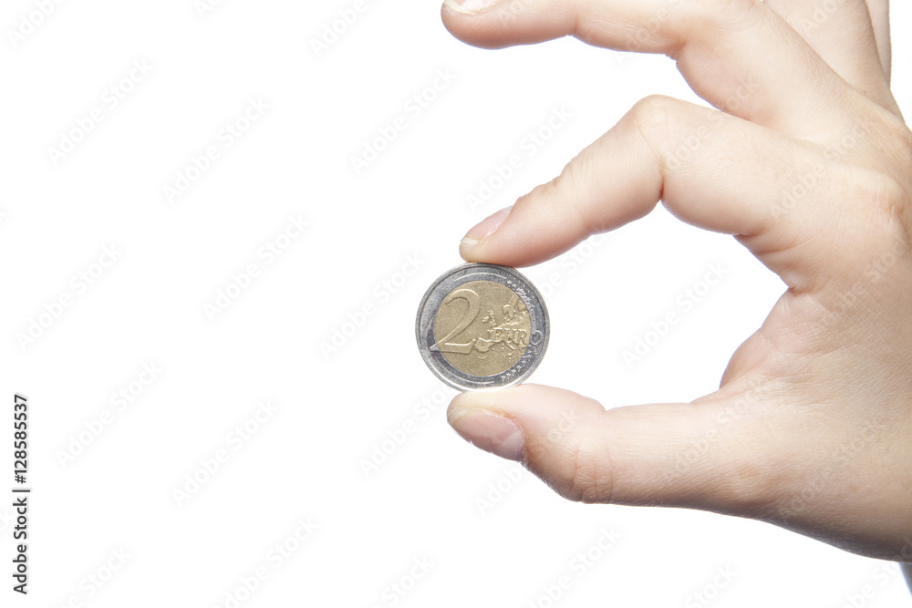 Fototapeta premium two euros hold in the fingers, white background, copy space