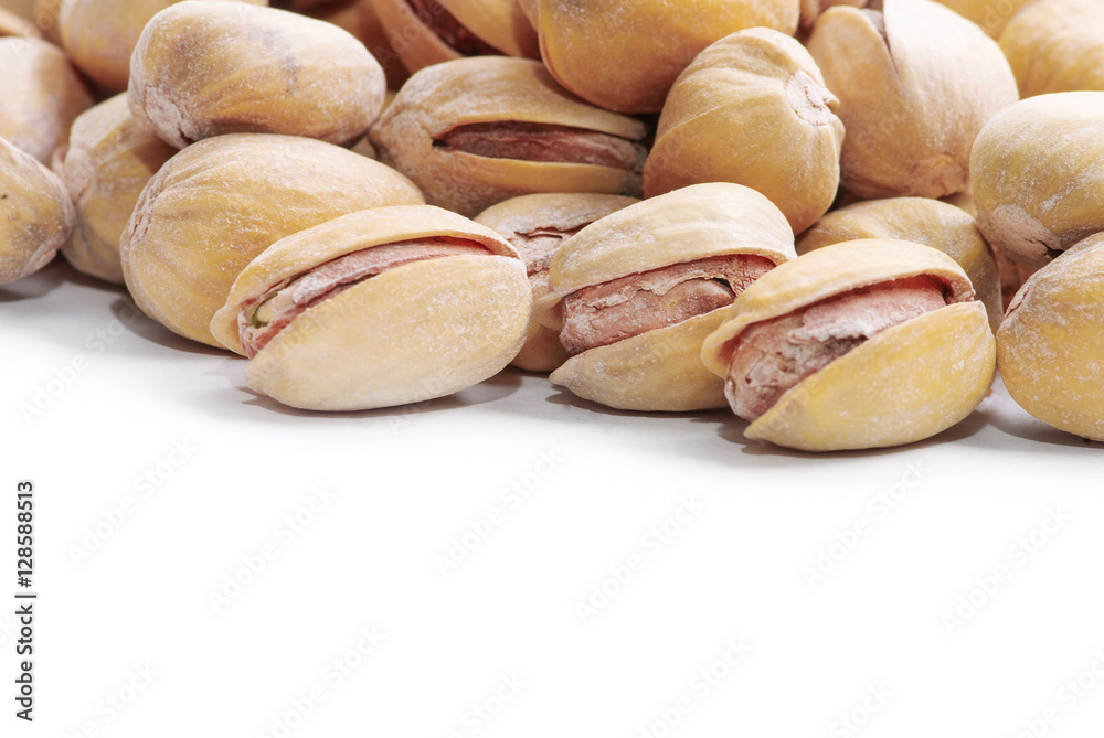 Pistachio nuts. Isolated on a white background. Pistachio nuts. Isolated on a white background.
