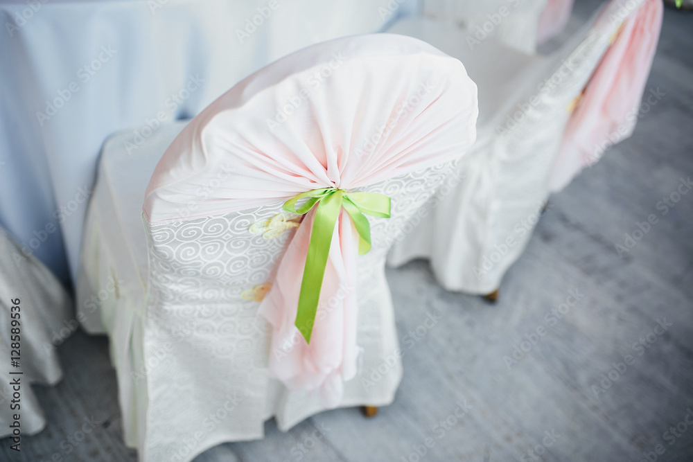 Decorated chairs for the guests in the wedding restaurant Decorated chairs for the guests in the wedding restaurant