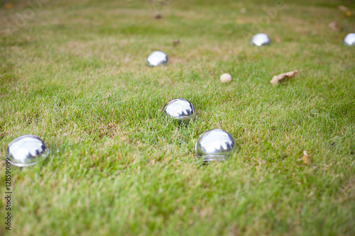 Petanque balls on the grass (shallow DOF)