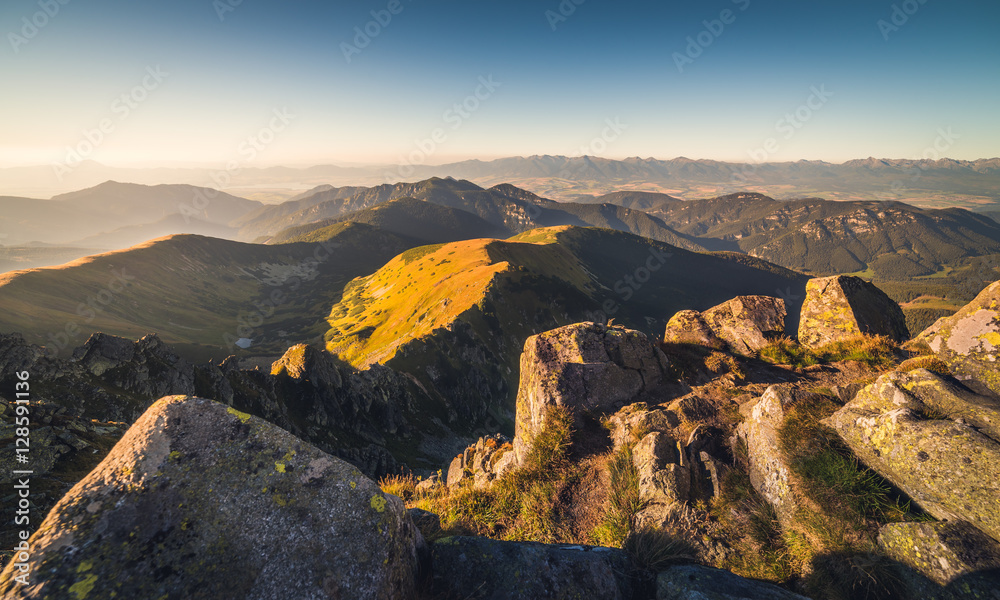 Evening Mountain Landscape with Rocks in Foreground. View from Mount Dumbier in Low Tatras National Park, Slovakia.