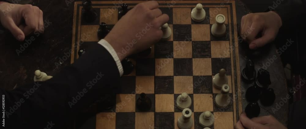 Playing chess closeup, wooden chess board. Chessboard and chess pieces