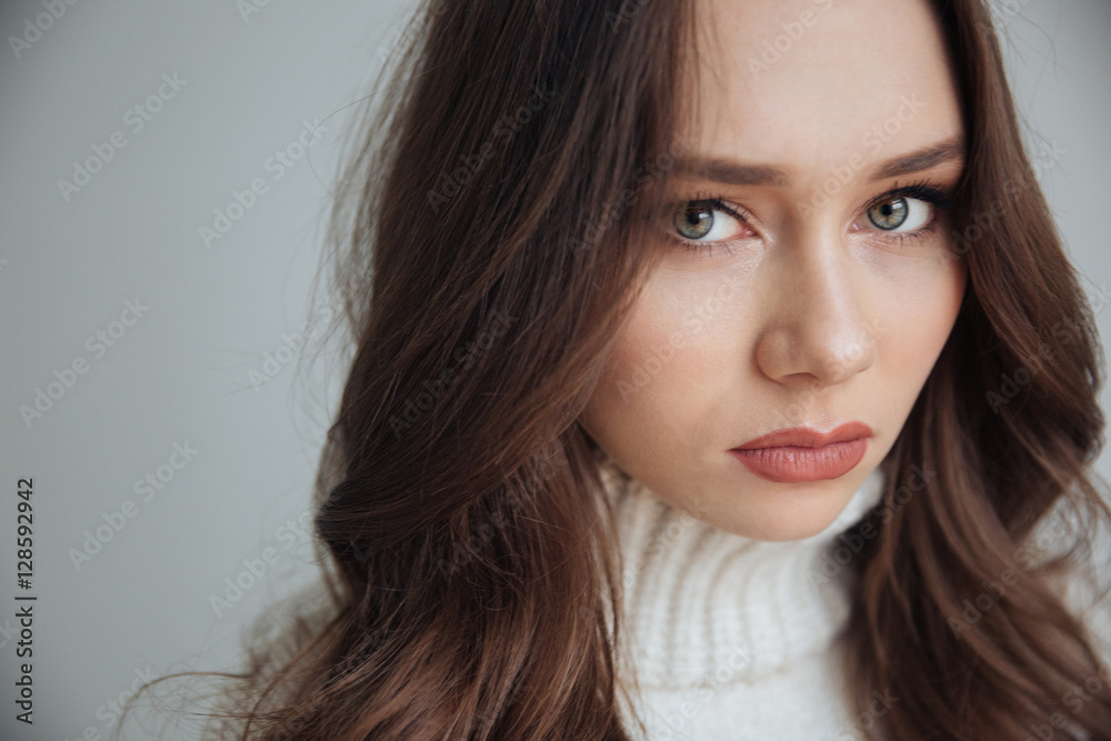 Close up serious woman in sweater Close up serious woman in sweater