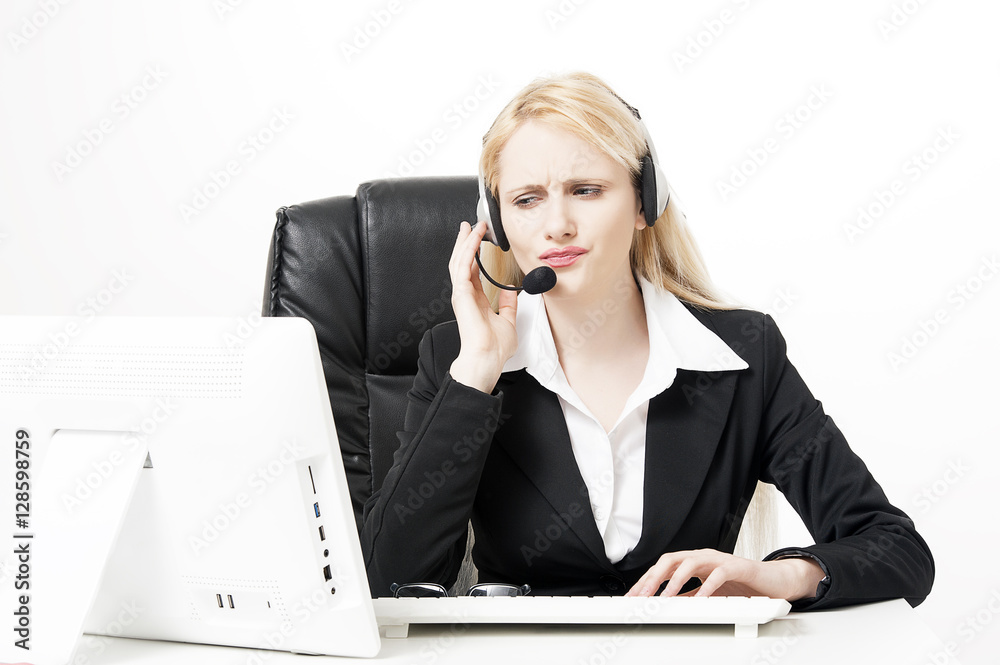 Female office assistant has a call at the office Female office assistant has a call at the office