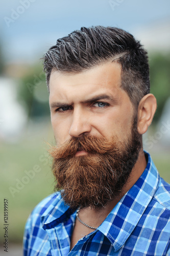 Frown bearded man outdoor