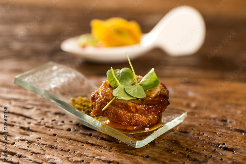 Pork ballotine with pururuca, water flour, pumpkin puree and sprouts in a spoon. Taste gastronomy fingerfood