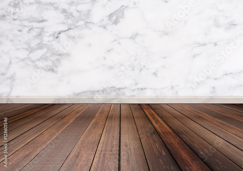 Hardwood floor with white marble stone wall texture background