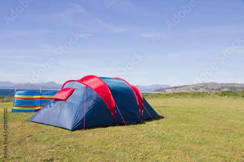 Camping tent under blue skies.