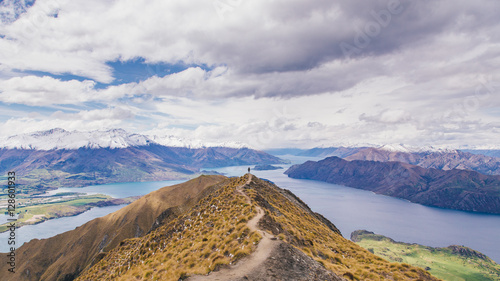 Man stand on Roy's Peak in New Zealand