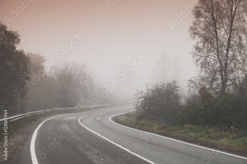 Rural foggy road background photo