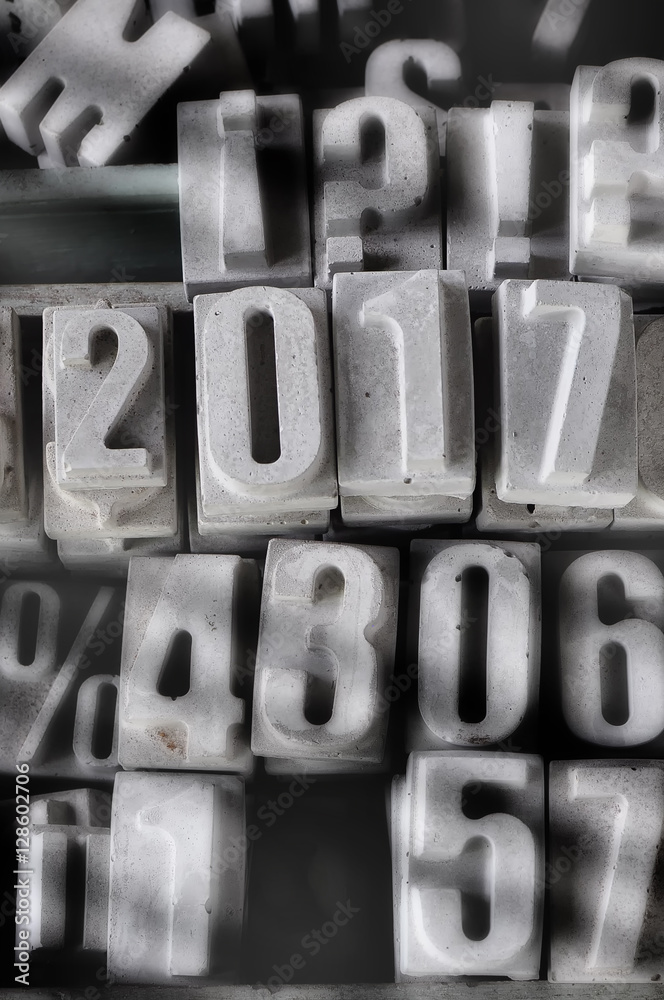 Happy new year 2017 on cement texts and numbers background, happy new year concept and cement decorative idea Happy new year 2017 on cement texts and numbers background, happy new year concept and cement decorative idea