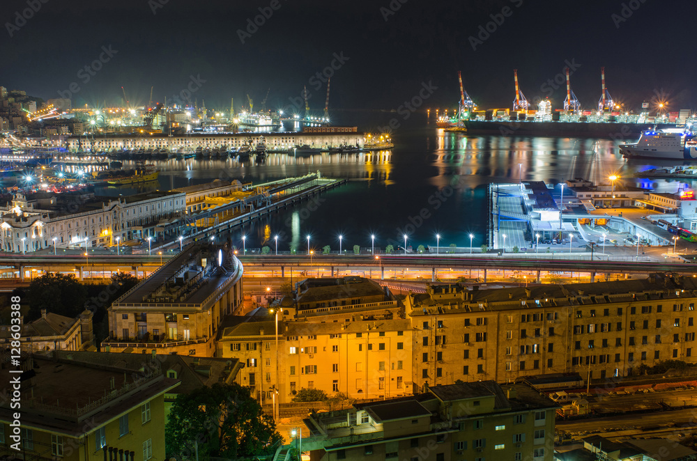 Fototapeta premium Vista of the beautifully lit Harbor of Genoa, seen from the rooftops of the San Teodoro neighborhood