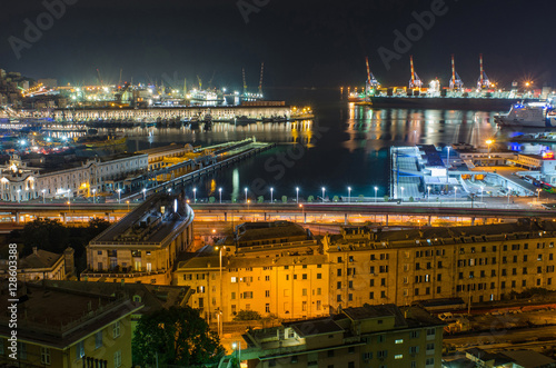 Vista of the beautifully lit Harbor of Genoa  seen from the rooftops of the San Teodoro neighborhood