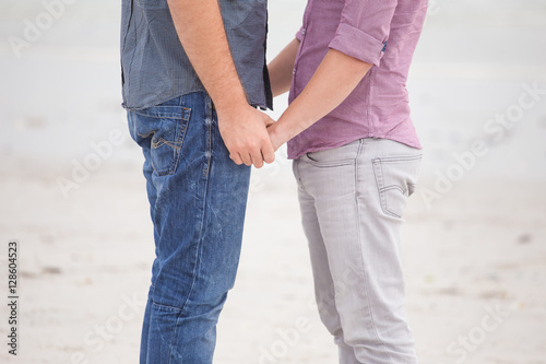 Close up image of a same sex or Gay male couple being loving and