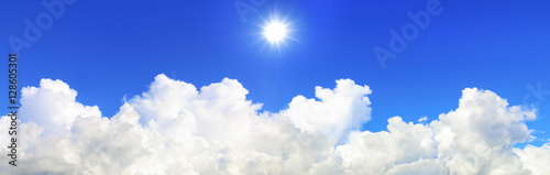 panorama of sun shines on blue sky and white cloud