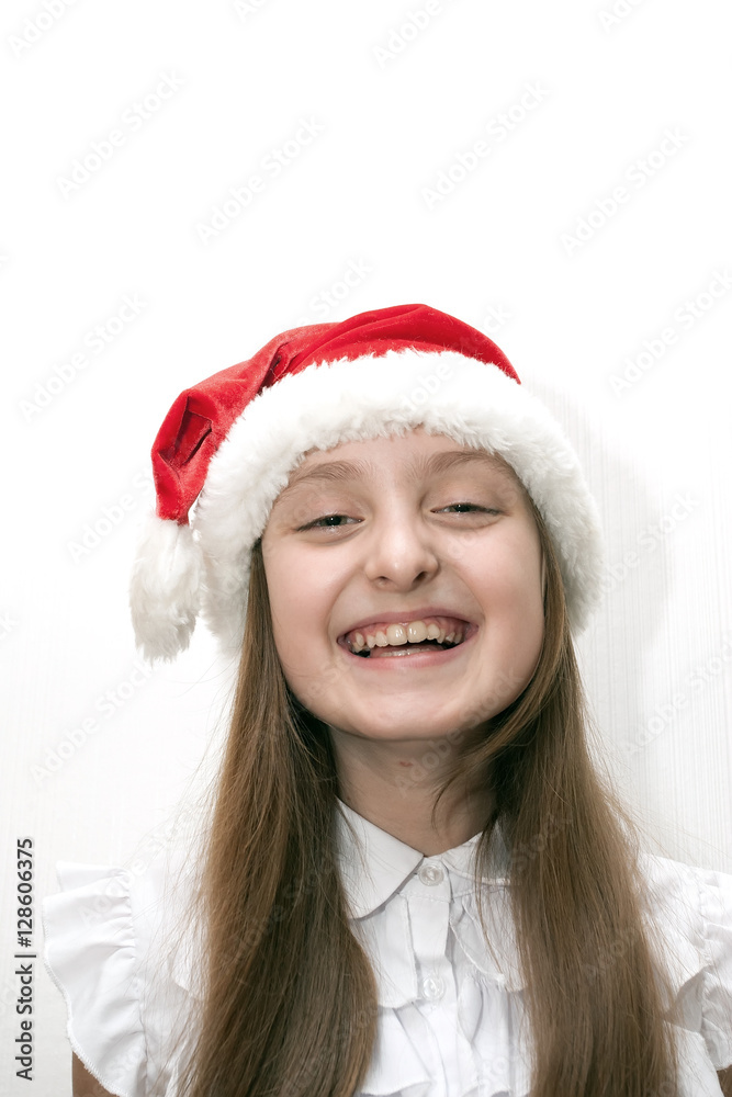 little girl in red santa hat 

