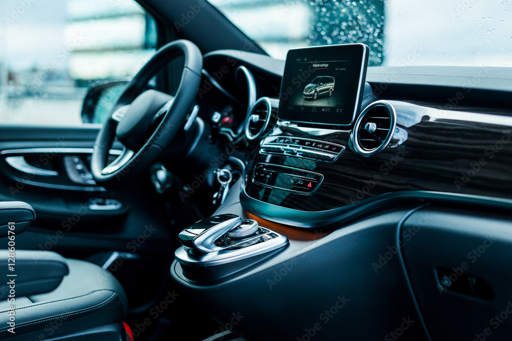 Luxury car interior details. Dashboard, steering wheel
