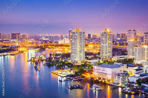 The City of Chaopraya river with light and reflection in twilight. Bangkok, Thailand