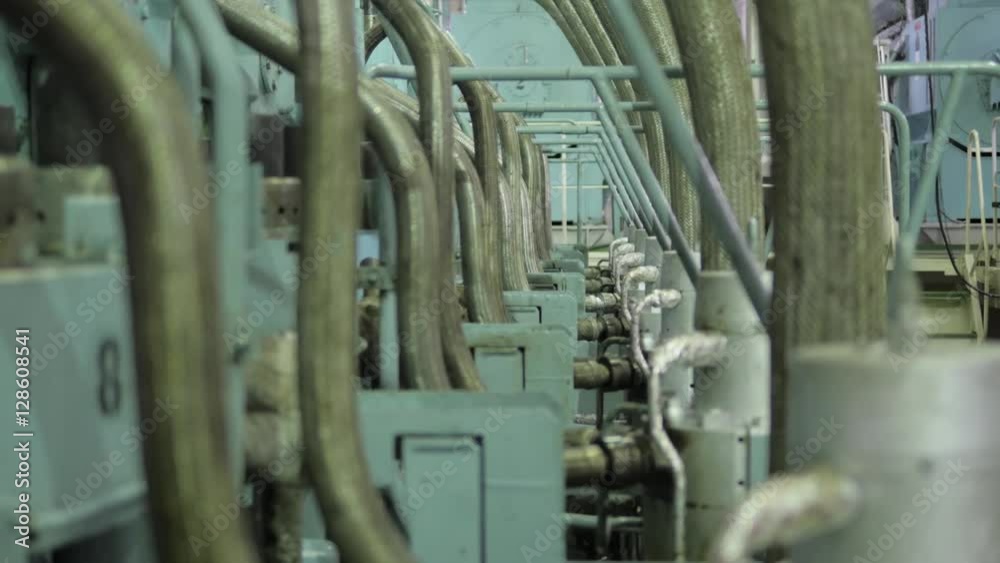 Main engine of ship, close to pipes, loud, hand held. Main engine of ship, close to pipes, loud, hand held.