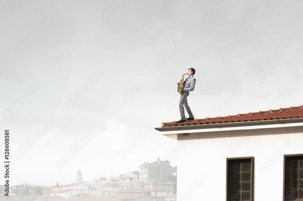 Giant man looking on saxophonist playing . Mixed media Giant man looking on saxophonist playing . Mixed media