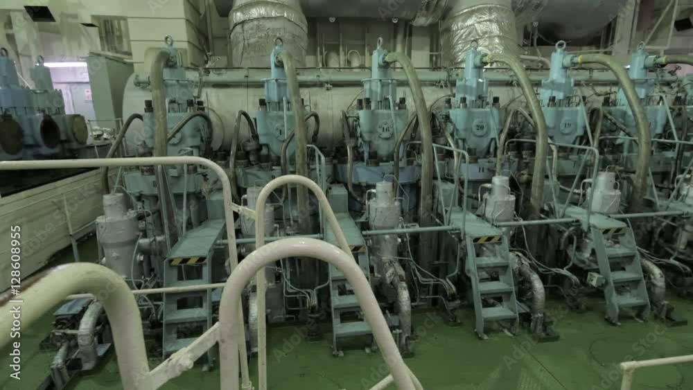 Main engine of ship, low speed two stroke cross head diesel. Noise in engine room. Main engine of ship, low speed two stroke cross head diesel. Noise in engine room.