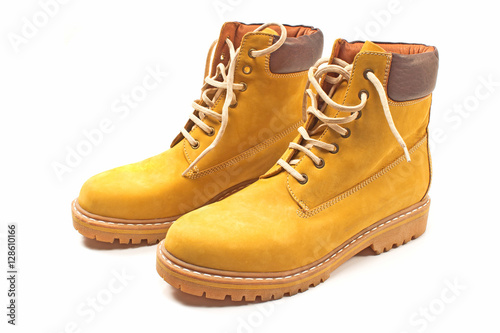 New yellow winter boots isolated on white