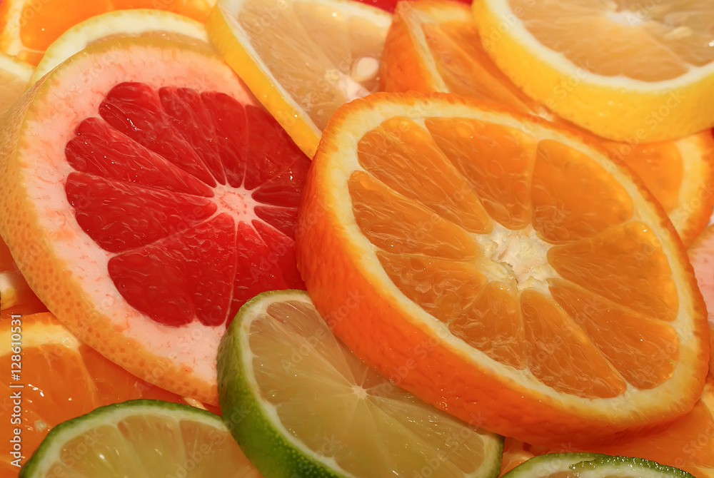 juicy fruit background from various slices of citrus juicy fruit background from various slices of citrus