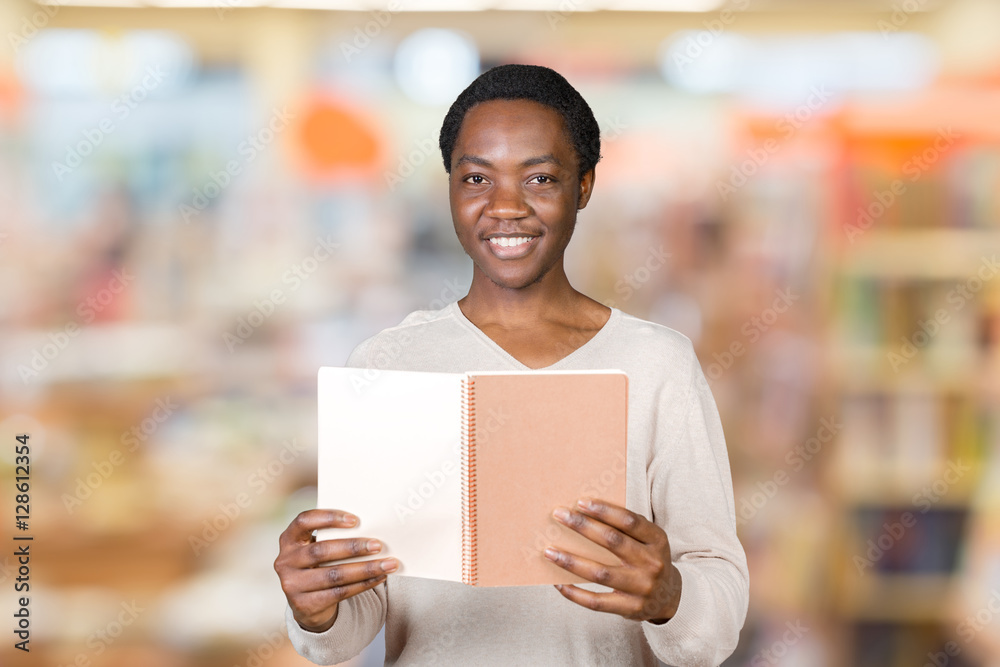 Young African American Male Holding Notepad Young African American Male Holding Notepad