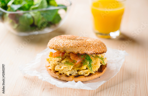 Breakfast sandwich on bagel with salmon,egg