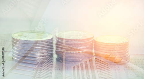 Double exposure of coins and modern city background, Finance and banking concept