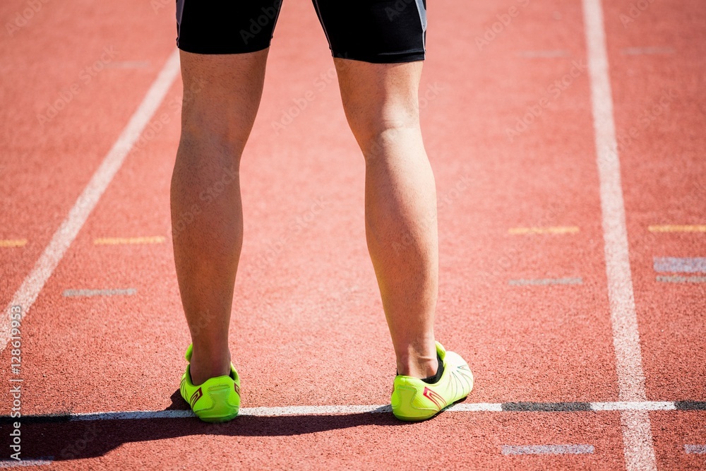 Feet of an athlete on running track
