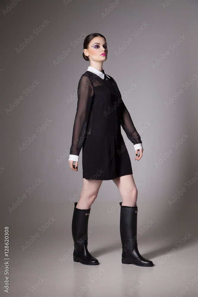 Fashion Image young woman in a stylish black dress. Fashion Image young woman in a stylish black dress.