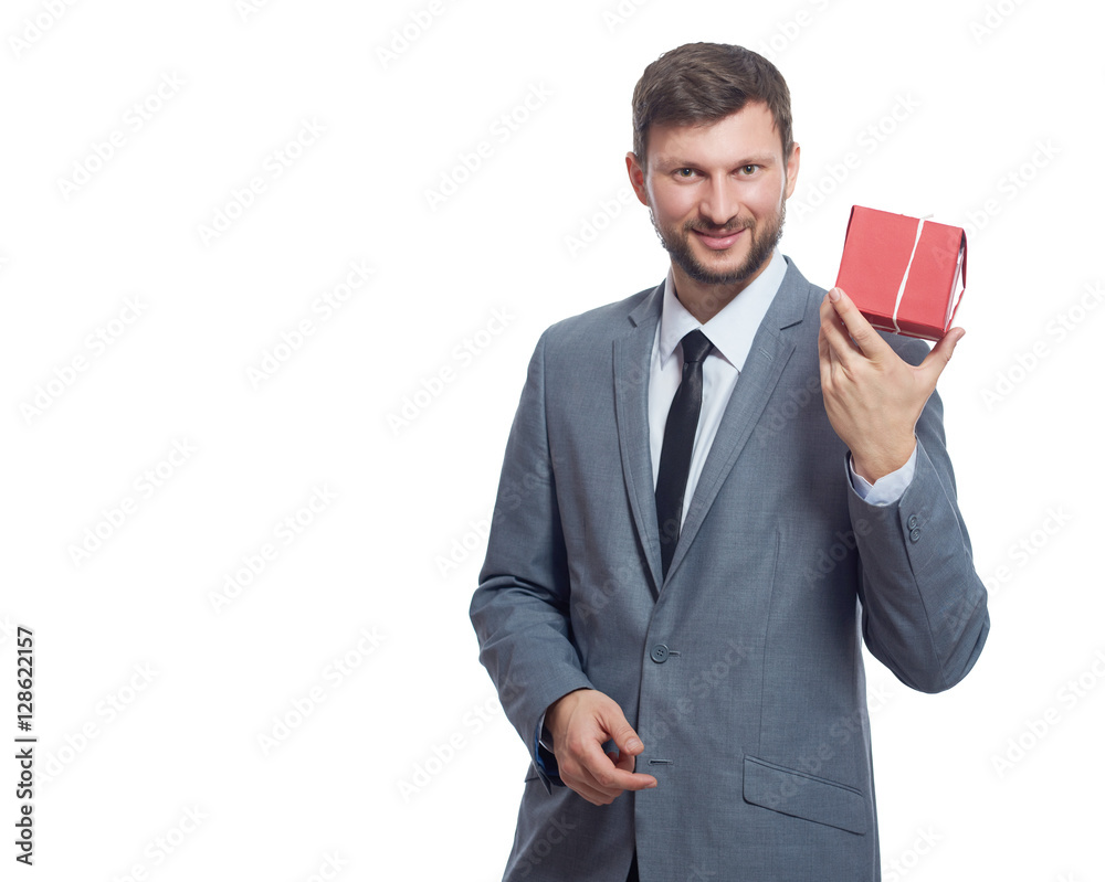 Bearded businessman holding a present Bearded businessman holding a present