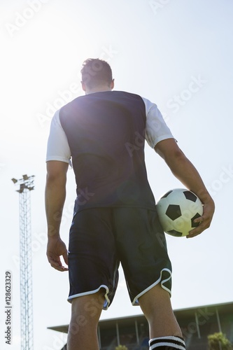 Low angle view of a soccer player with a ball