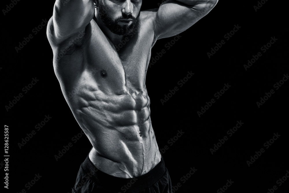 Fototapeta premium Muscular bodybuilder guy doing posing