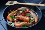 Cooked shrimps,prawns with seasonings in frying pan