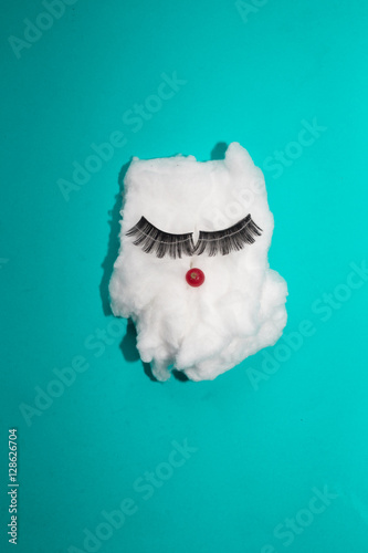 cotton with fake eyelashes for conceptual theme, colorful background photo