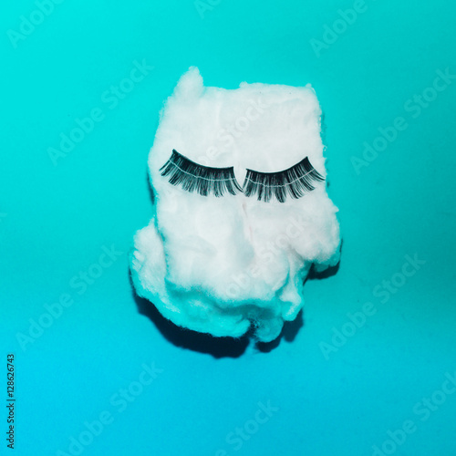 cotton with fake eyelashes for conceptual theme, colorful background photo