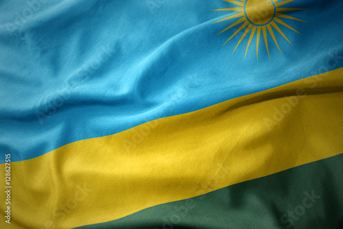 waving colorful flag of rwanda.