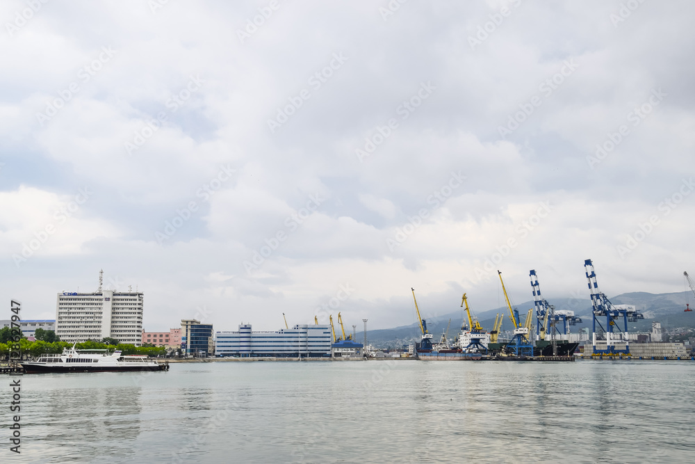 The international sea port of Novorossiysk. Port cranes and industrial objects. Marine Station.