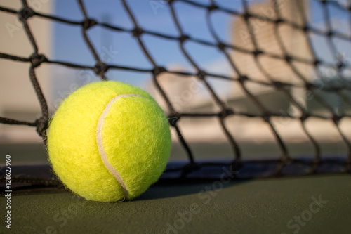 Tennis ball on hard court