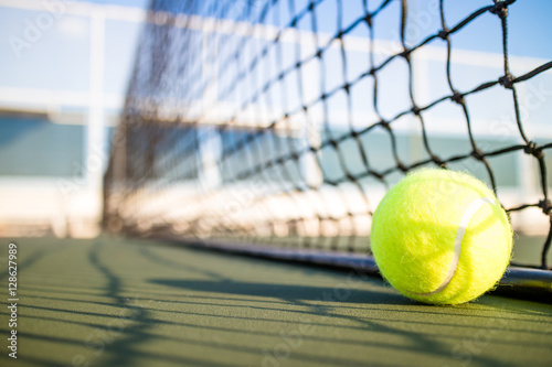 Tennis ball on hard court © icedmocha
