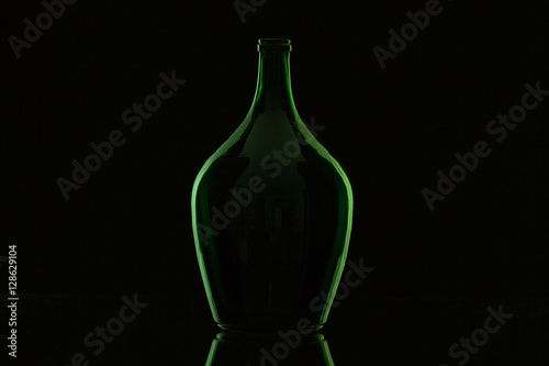 Silhouette of elegant and very old wine bottle