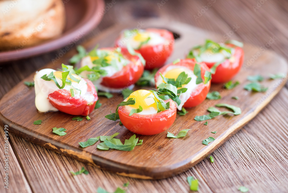 Baked eggs in tomato cups. 