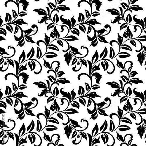 Seamless pattern with twisted branches with leaves on a white background